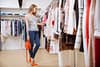 20170731110942 graphicstock beautiful young woman standing and choosing clothes in clothing store husr32zsne